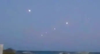 Fleet of Seven UFOs Seen and Filmed Following Each Other In The Skies Above Lake Michigan